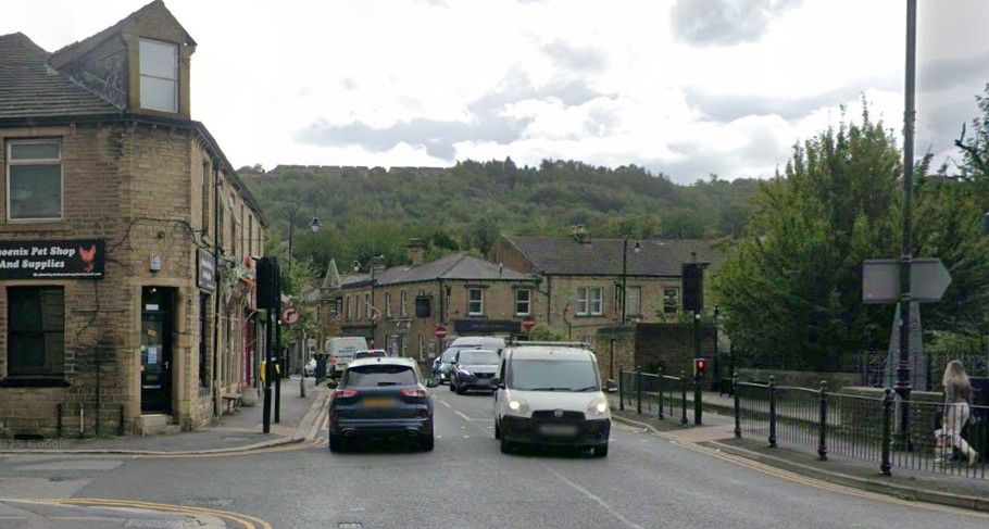 Street view of Milnsbridge centre. Airport Taxi Huddersfield.
